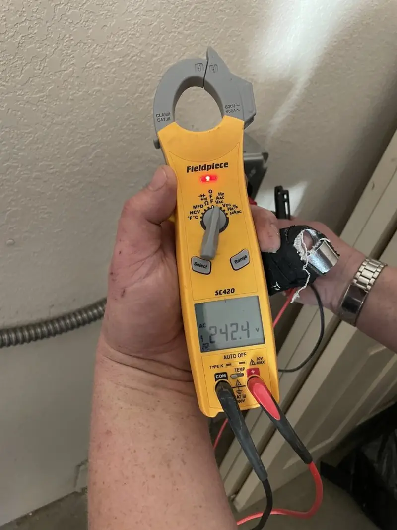 Voltage testing with clamp meter during Generator Installation in Scottsdale